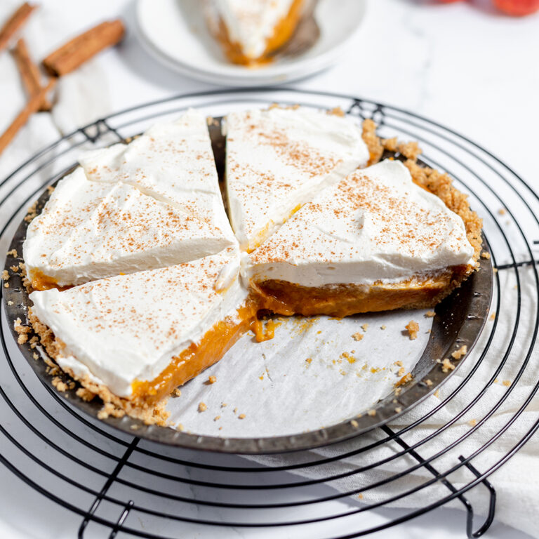 Pumpkin Cream Pie slices in baking pan on wire rack.