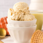 Scoops of Eggnog Ice Cream in dessert bowl.