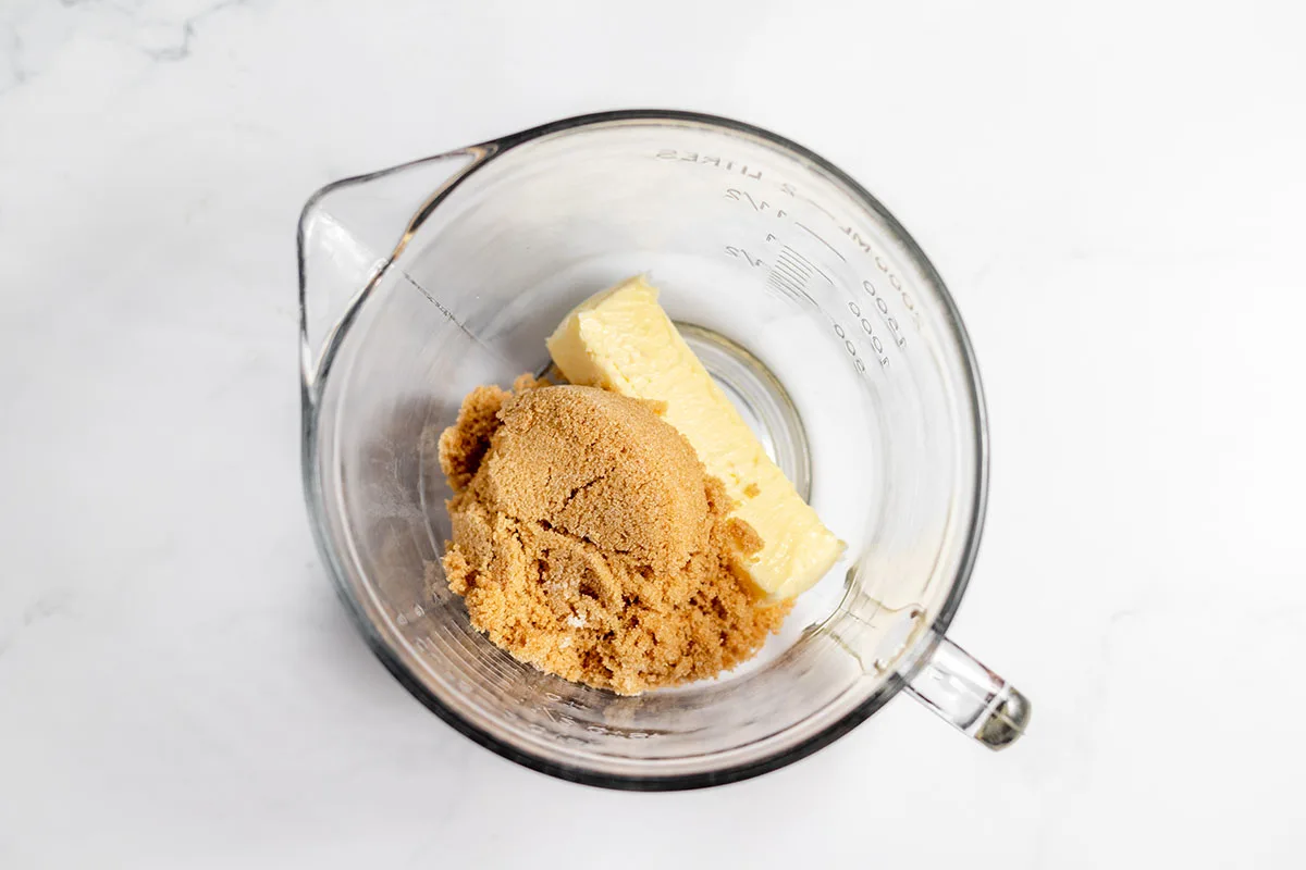Butter and brown sugar in a mixing bowl.