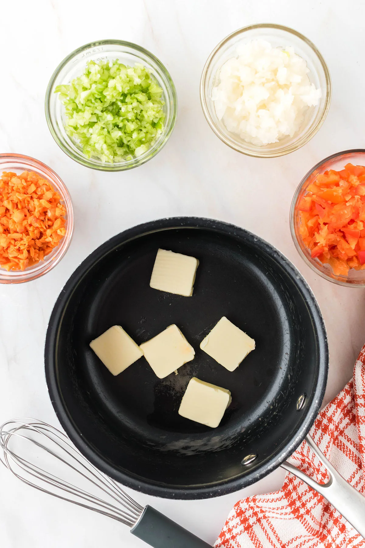 Chunks of Butter in a saucepan to melt.