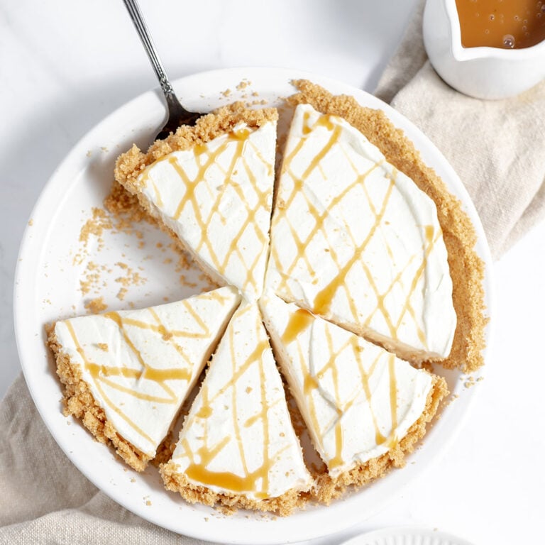 Caramel Pie in pie plate cut into slices.