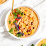 Chicken Enchilada Soup in a white bowl.