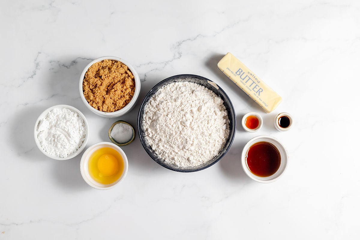 Ingredients to make Maple Brown Sugar Cookies set out on the counter.