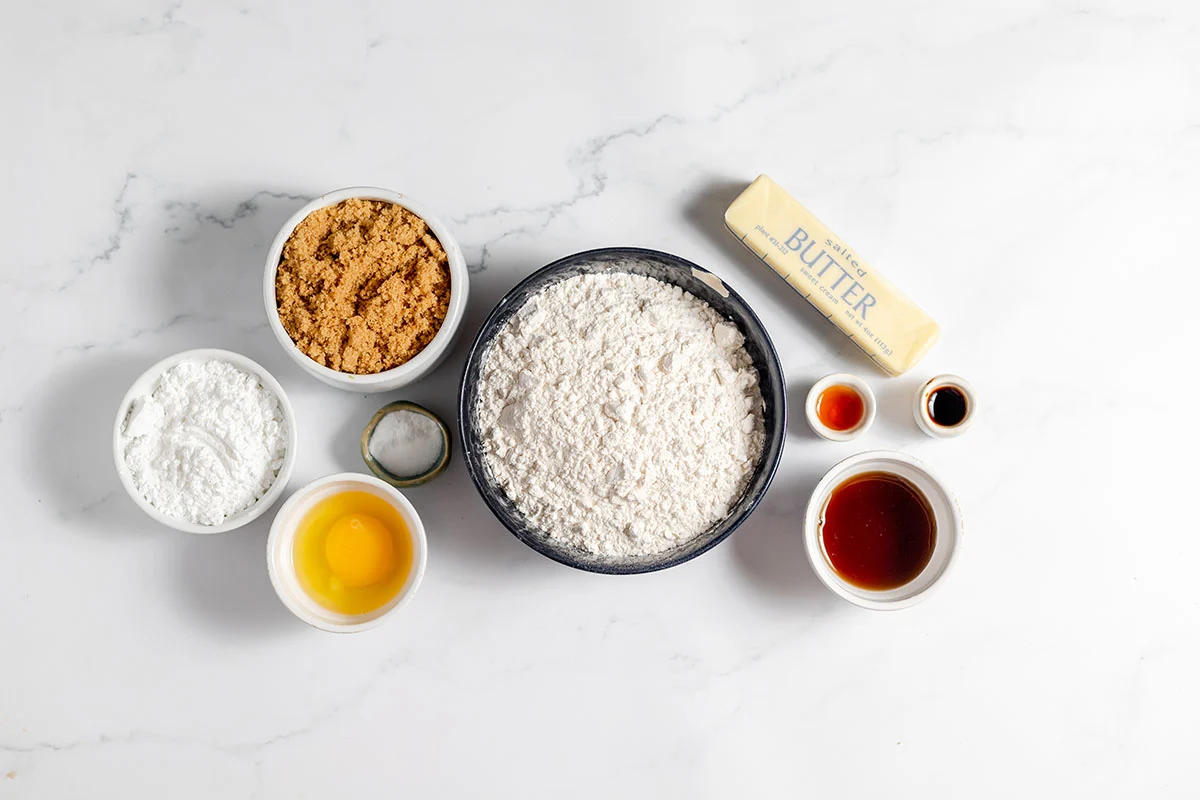 Ingredients to make Maple Brown Sugar Cookies set out on the counter.