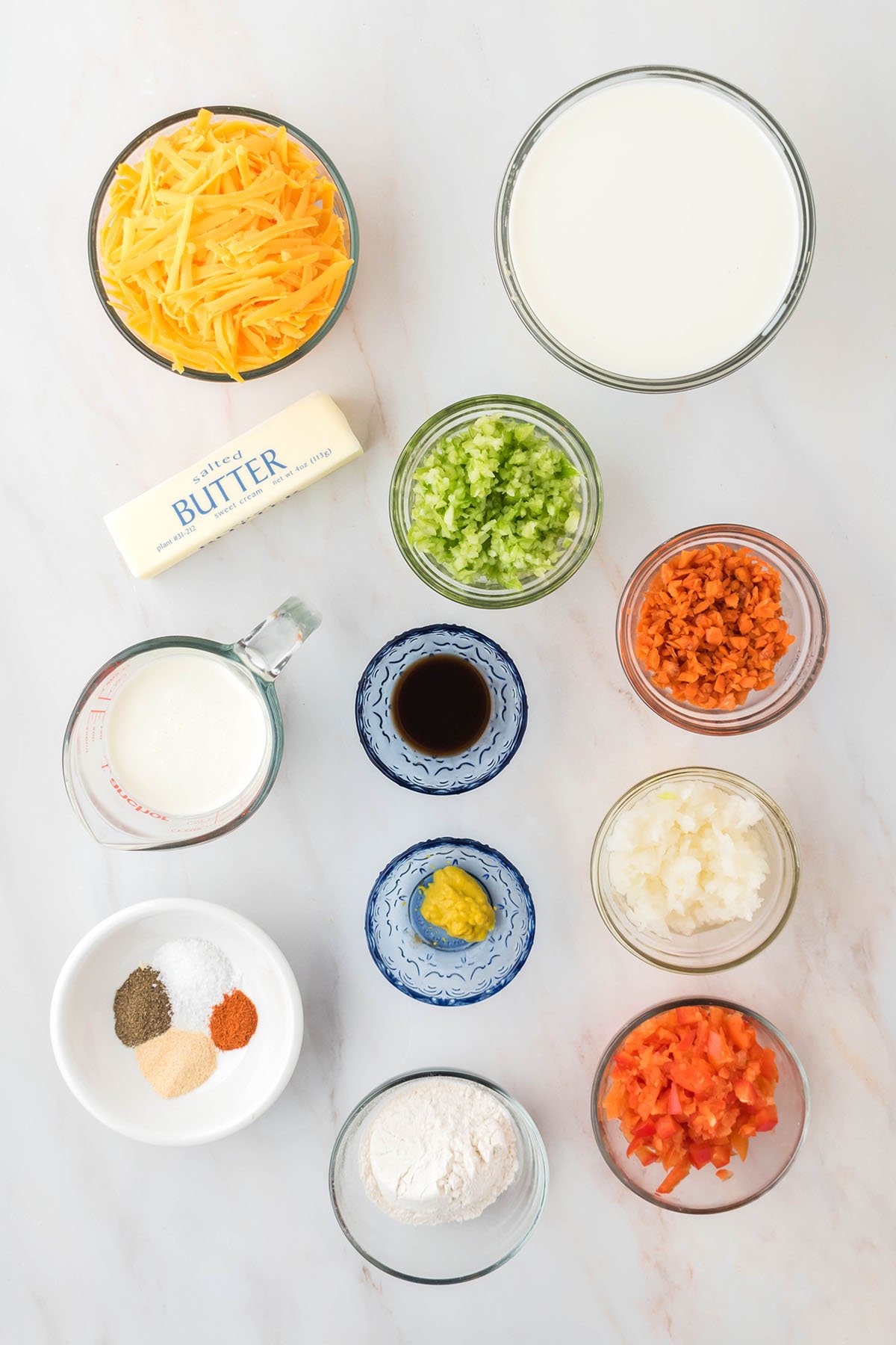 Ingredients to make cheese soup set out on the counter.