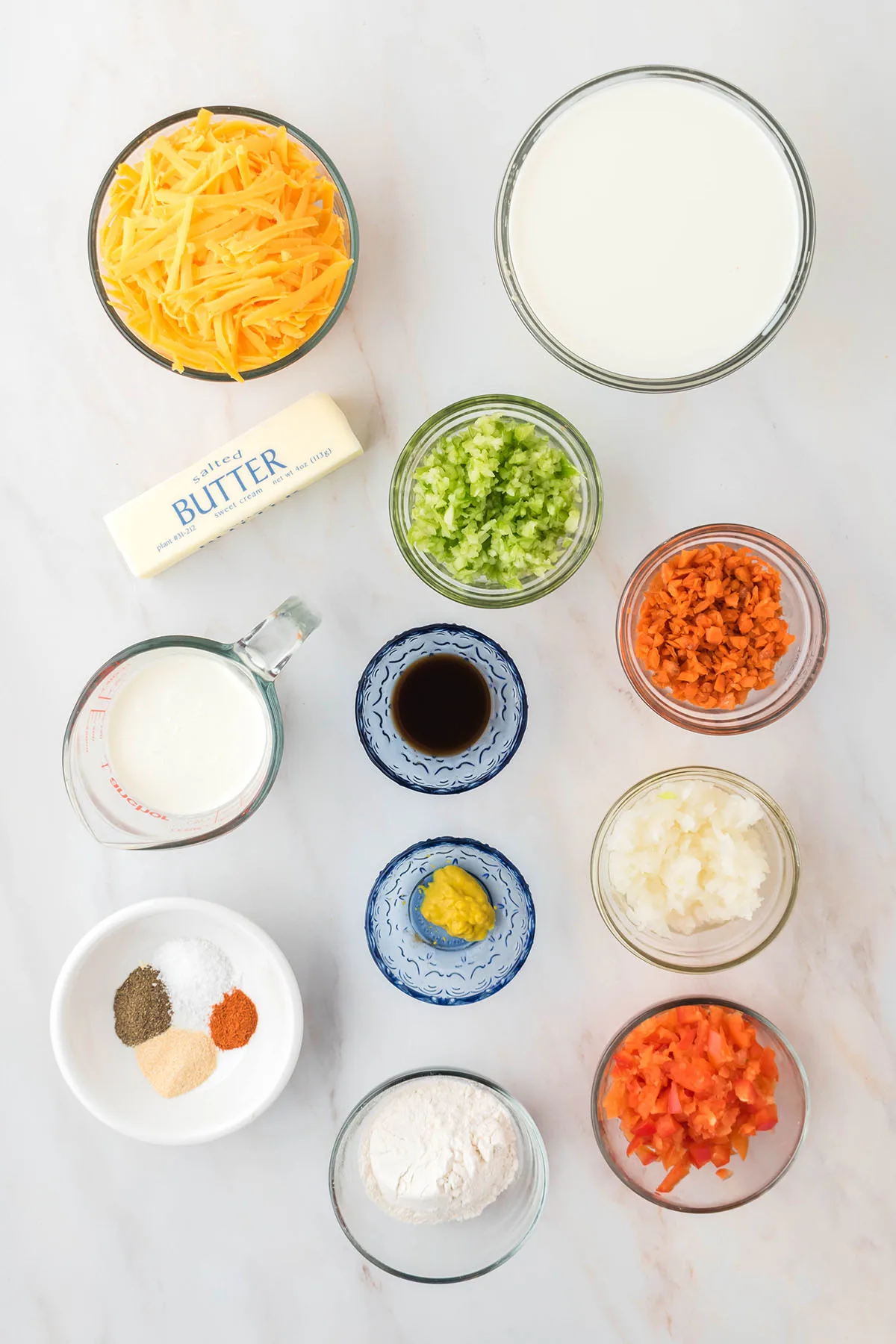 Ingredients to make cheese soup set out on the counter.