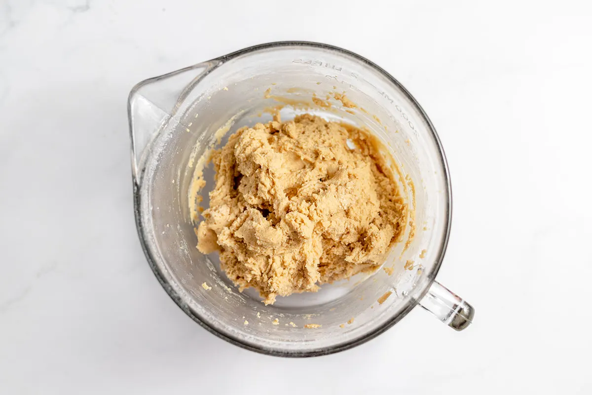 Cookie batter in a mixing bowl.