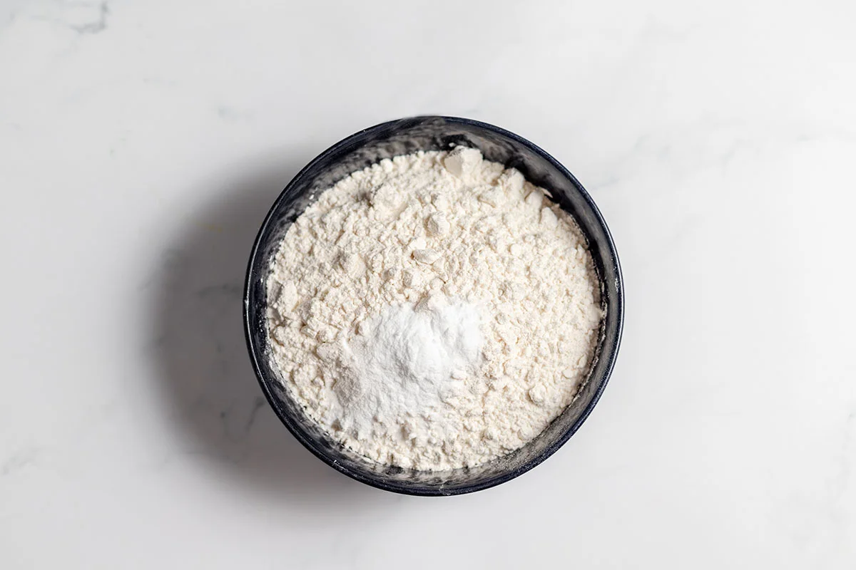 Flour, baking soda, and salt in a bowl.
