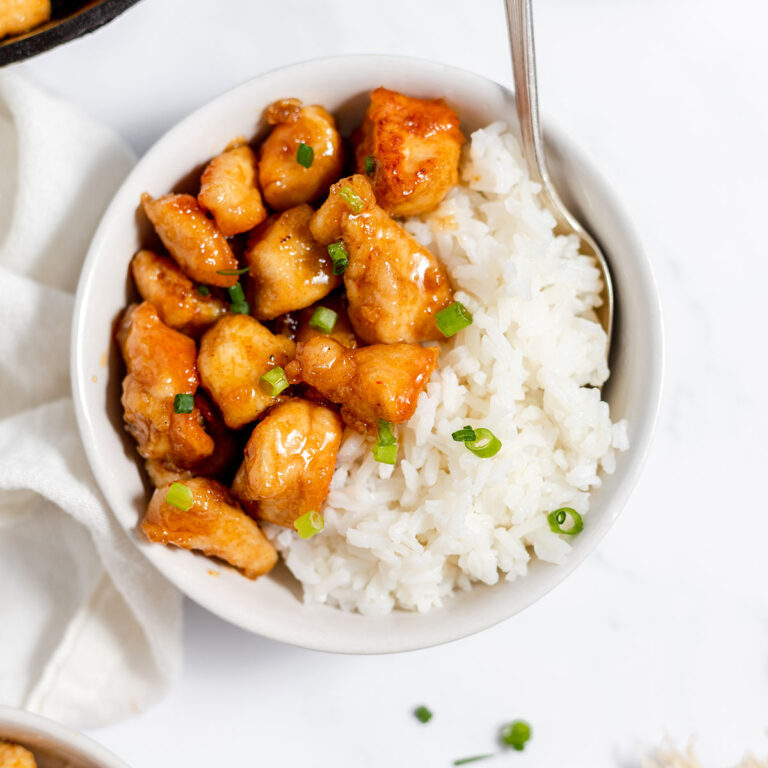 Firecracker Chicken in a bowl with white rice.