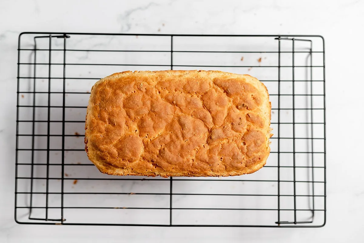 Baked English Muffin Bread cooling on a wire rack.