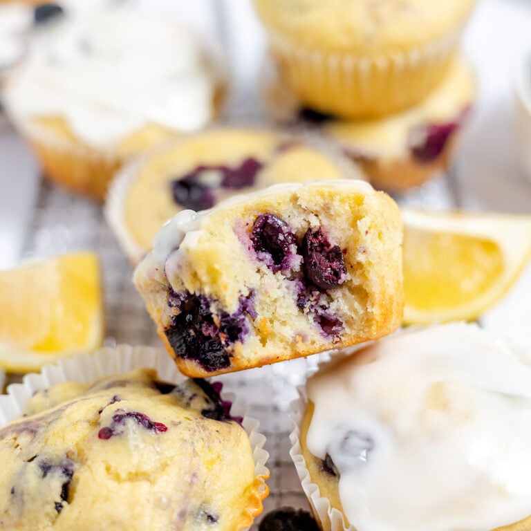 Blueberry Lemon Muffins on a wire rack.