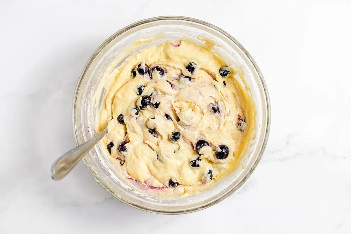 Blueberry lemon muffin batter in the mixing bowl.