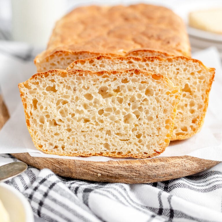 English Muffin Bread on a wooden serving board.