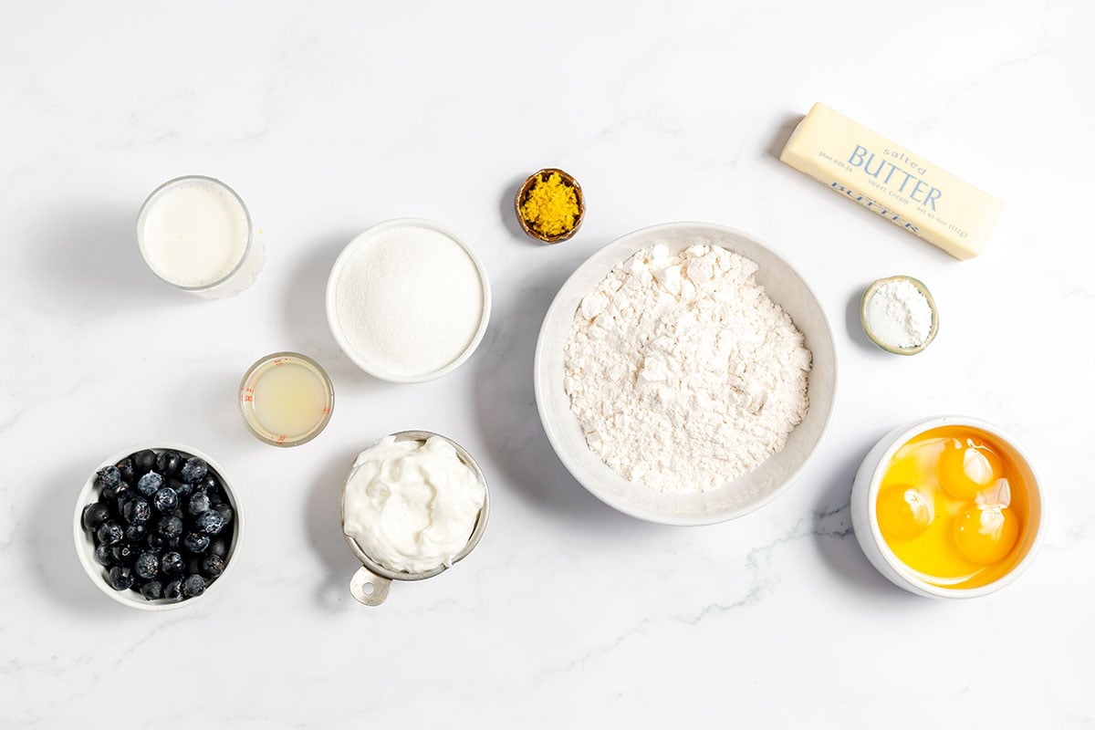 Ingredients to make Blueberry Lemon Muffins set out on the counter.