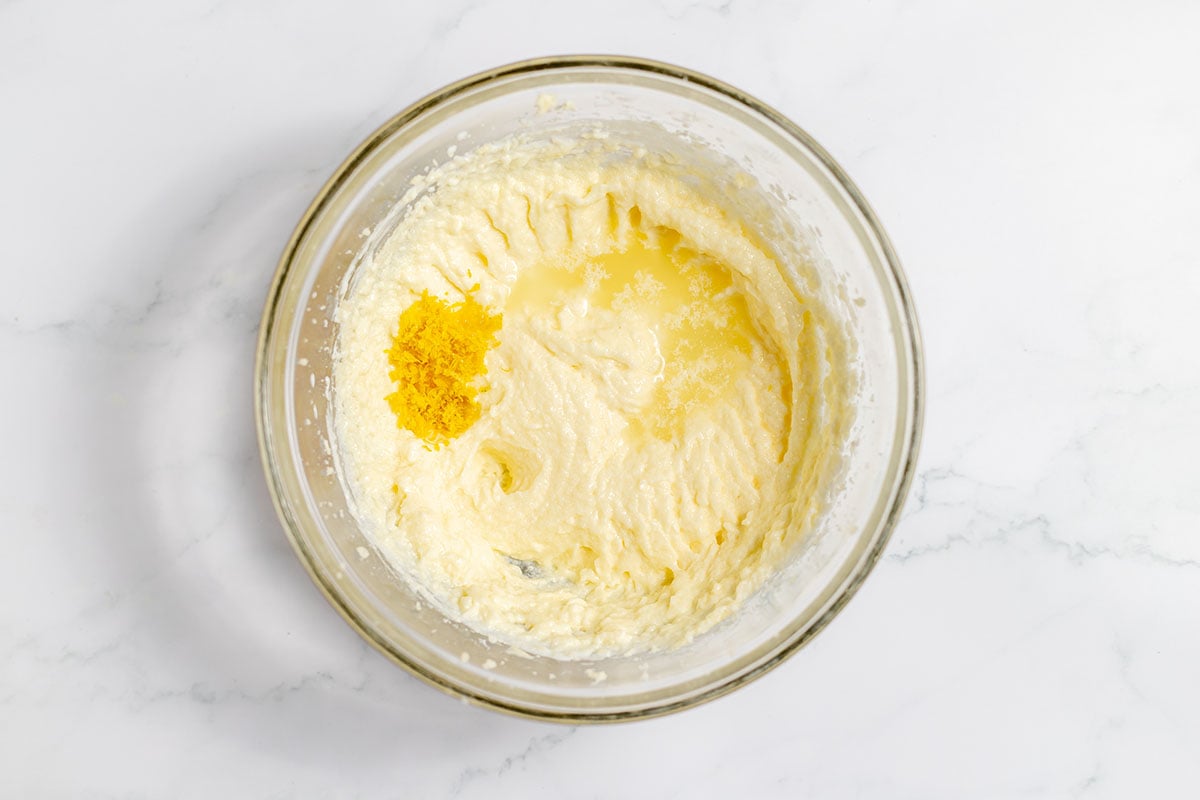 Lemon zest and lemon juice added to the mixing bowl.