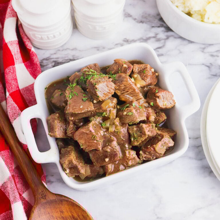 Beef Tips in a white serving dish.