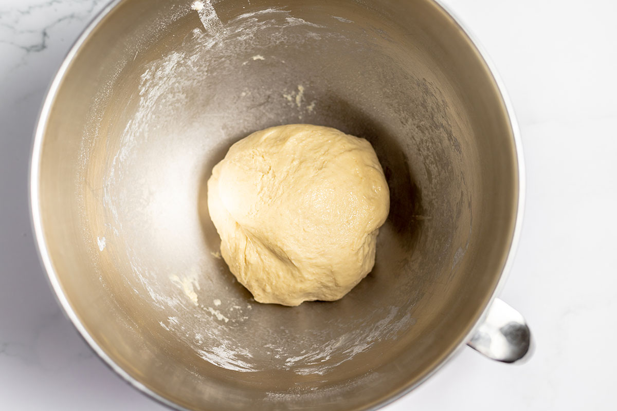 Strawberry Cinnamon Roll dough in a stand  mixer bowl.