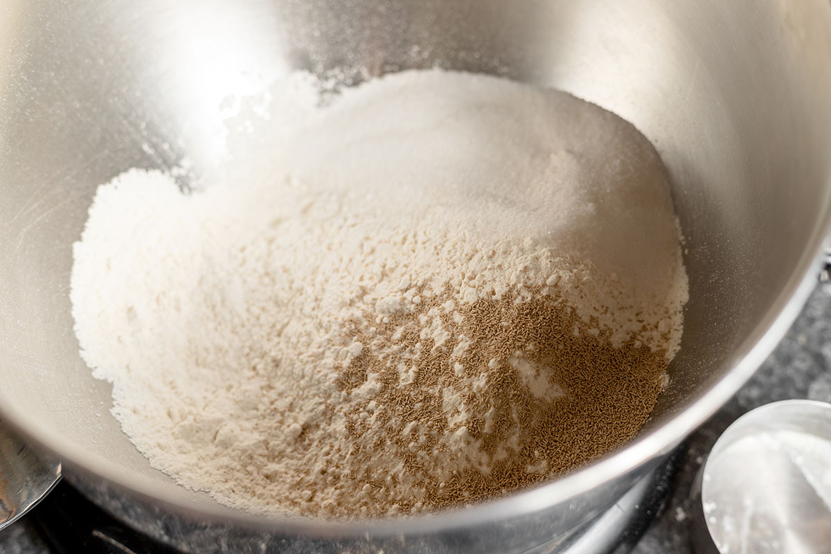 Flour, active dry yeast, sugar and salt in a stand mixer bowl.
