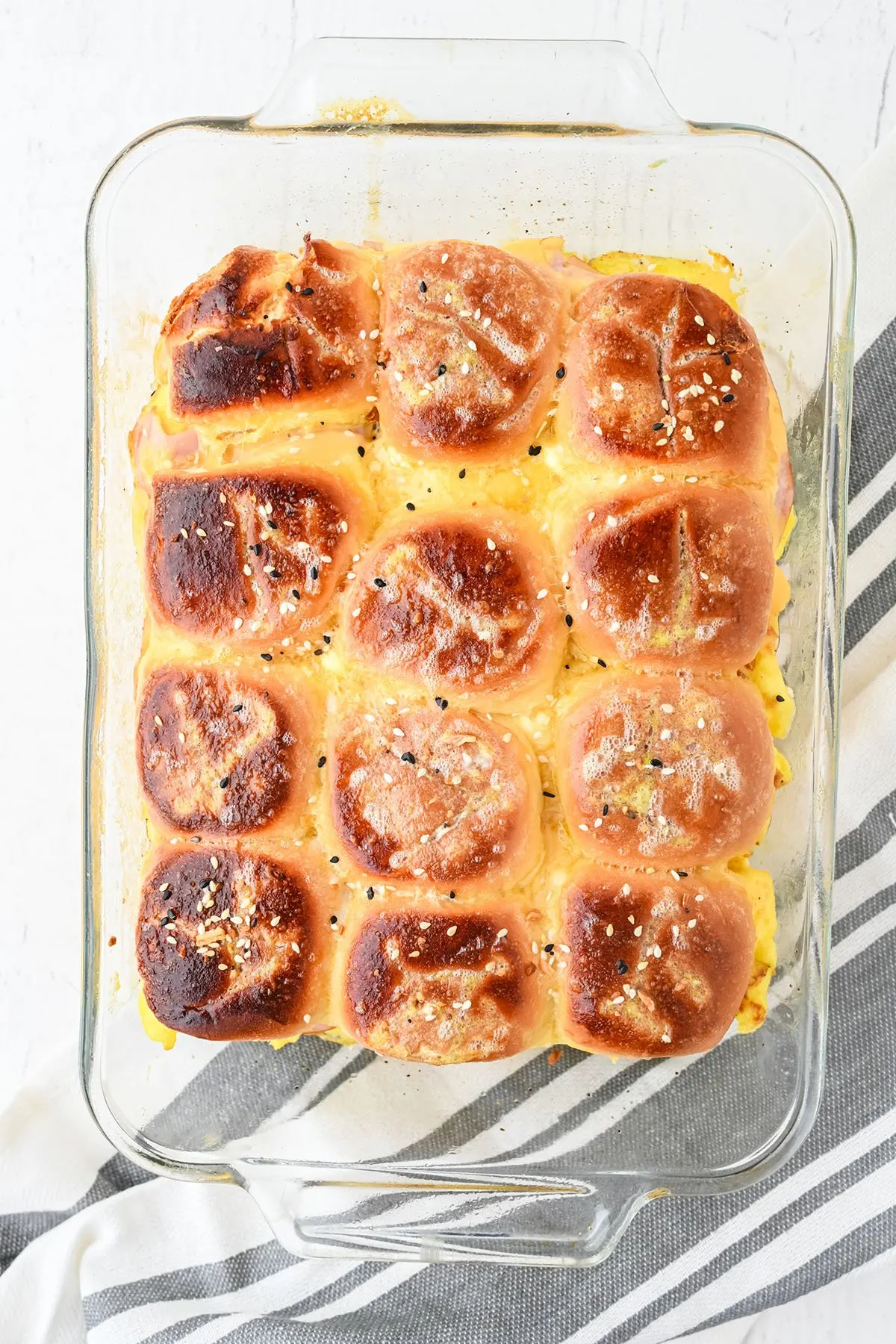 Baked Hawaiian Roll Breakfast Sliders in glass baking dish.