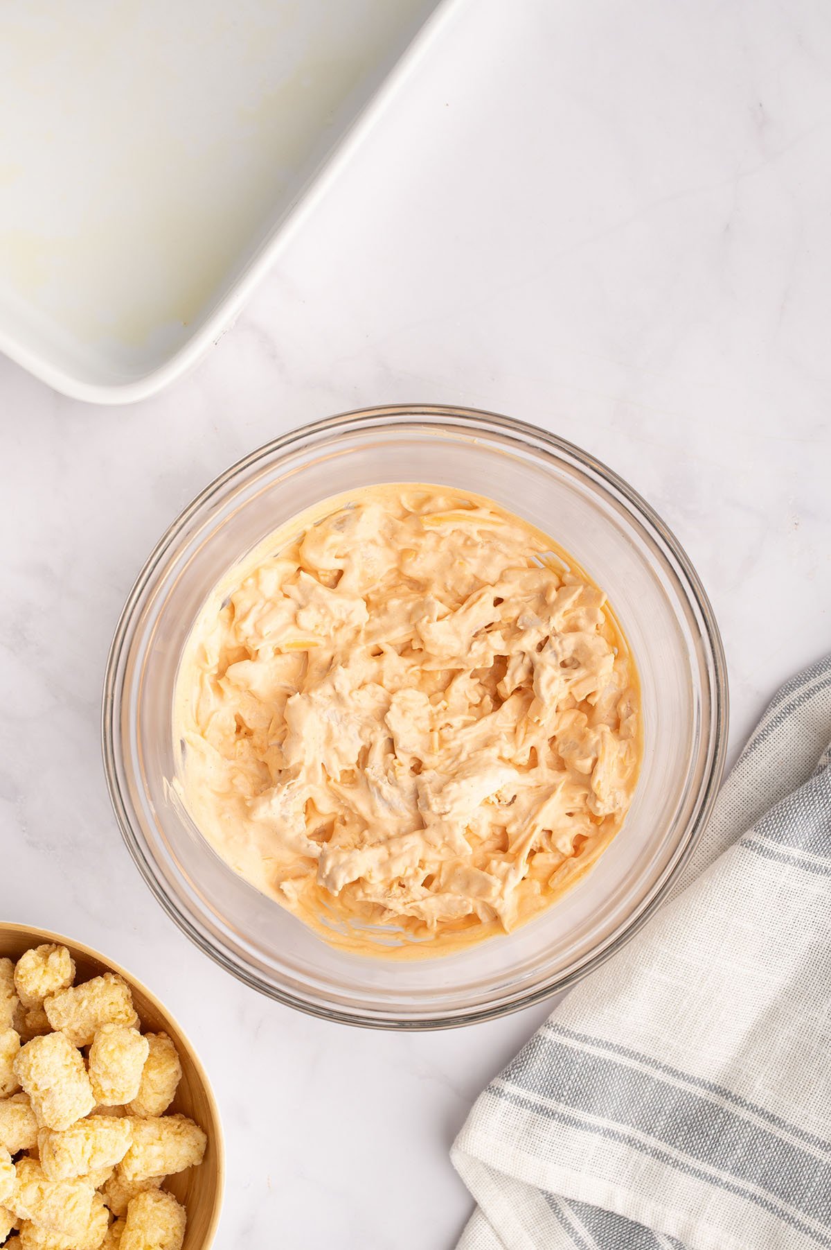 Buffalo chicken filling in a mixing bowl.