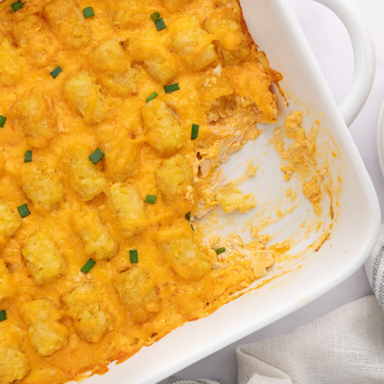 Buffalo Chicken Tater Tot Casserole in a white baking dish.