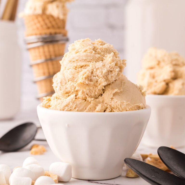 Scoops of Fluffernutter Ice Cream in a white dessert bowl.