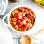 Pasta Fagioli served in a white bowl.