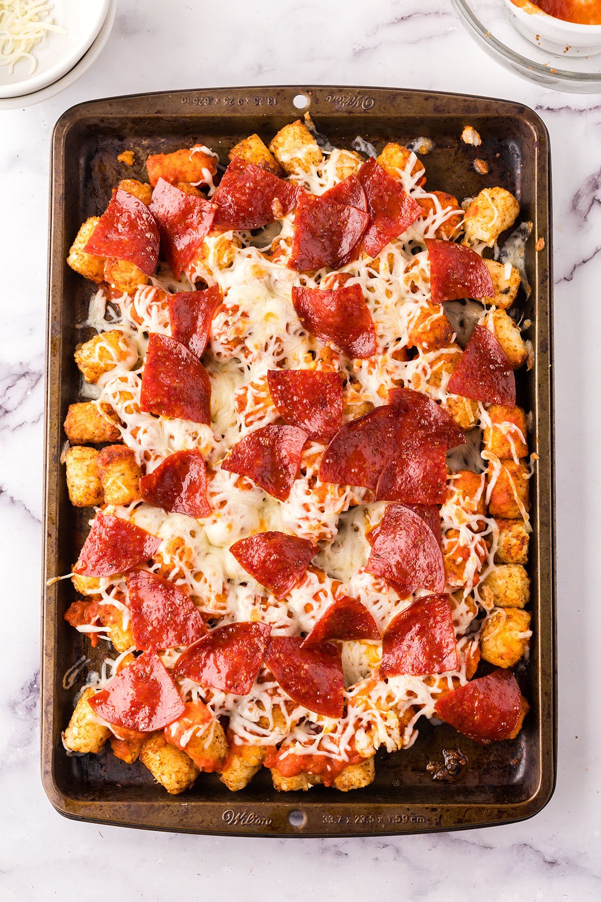 Baked Pepperoni Pizza Totchos on a baking sheet ready to serve.