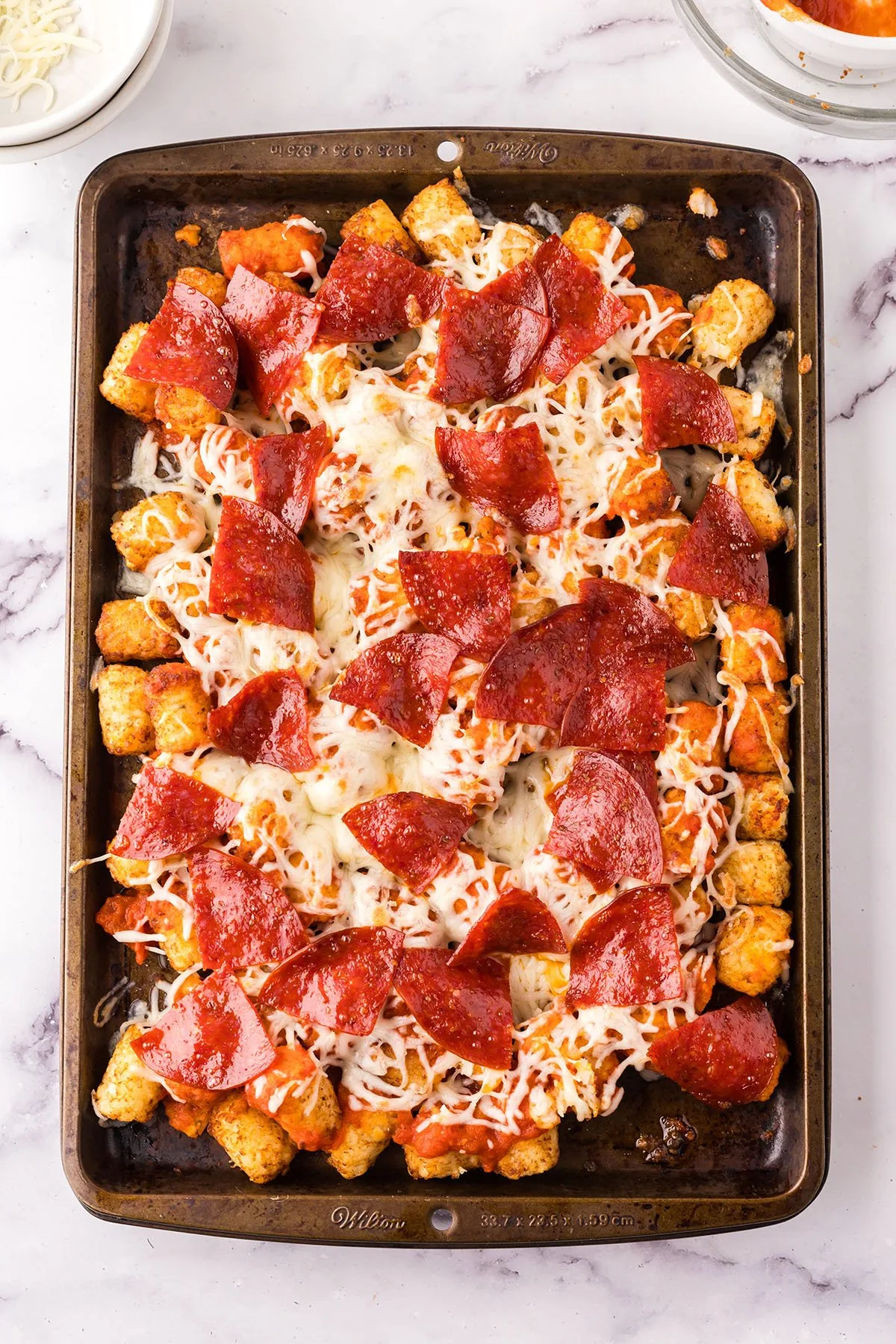 Baked Pepperoni Pizza Totchos on a baking sheet ready to serve.
