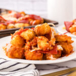 Pepperoni Pizza Totchos are served on a white plate.