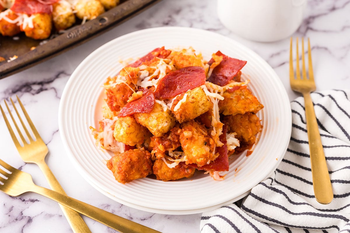 A white plateful of Pizza Totchos on the counter.