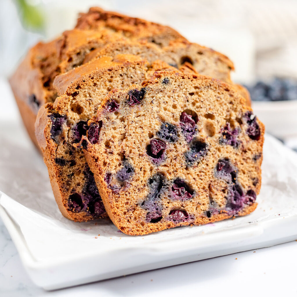Blueberry Banana Bread on a white serving platter.