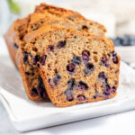 Blueberry Banana Bread on a white serving platter.