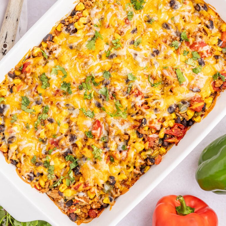 Taco Lasagna in white baking dish.