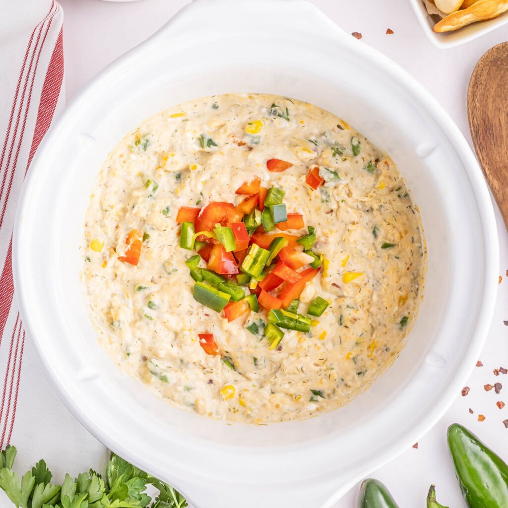 Jalapeno popper dip in the slow cooker ready to serve.