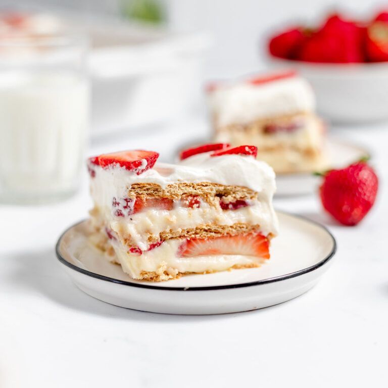 A slice of strawberry icebox cake on a plate.