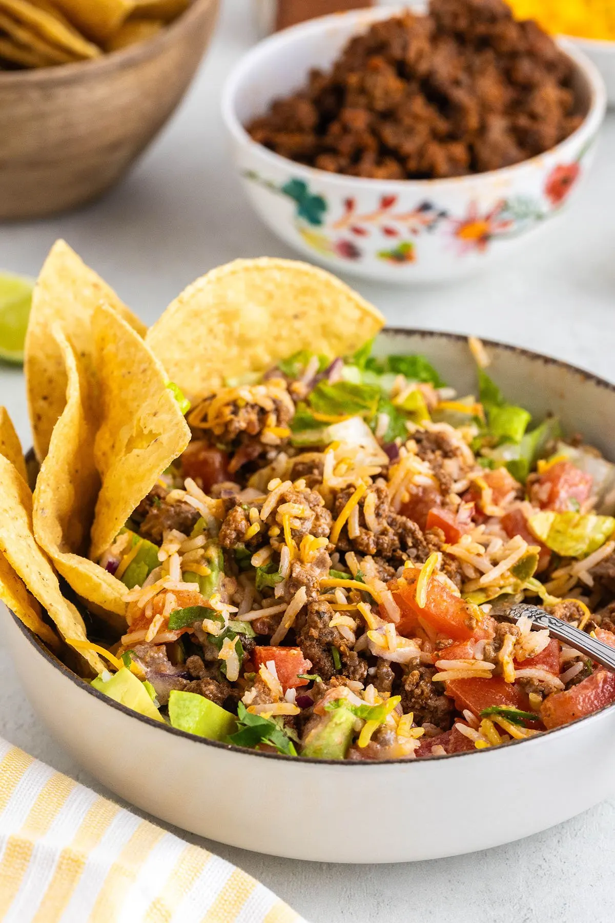 Beef Taco salad with salsa ranch dressing served in a bowl.