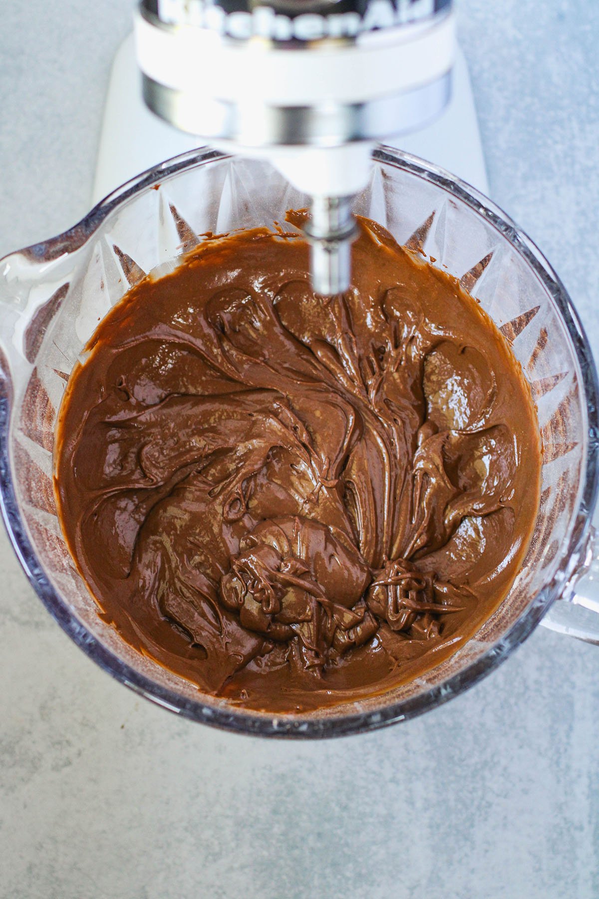 Donut batter in the stand mixer bowl.