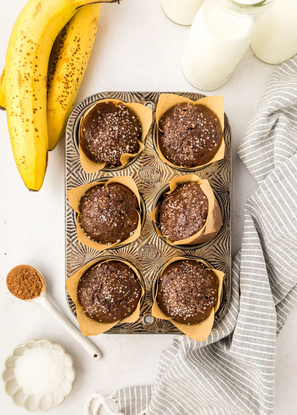 Baked Chocolate Banana Muffins in muffin pan.