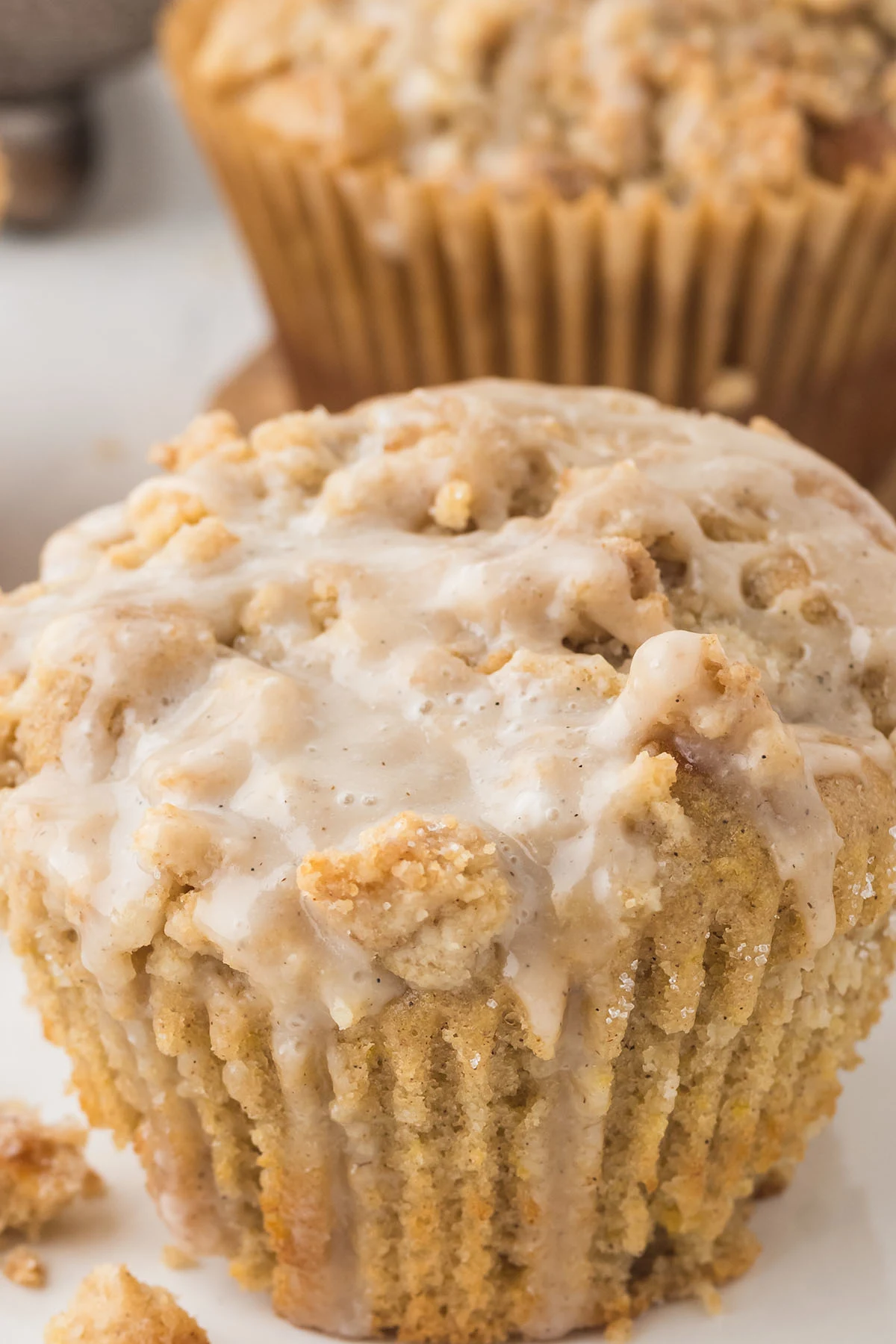 Glazed Coffee Cake Muffin topped with Streusel Crumble and a glaze.