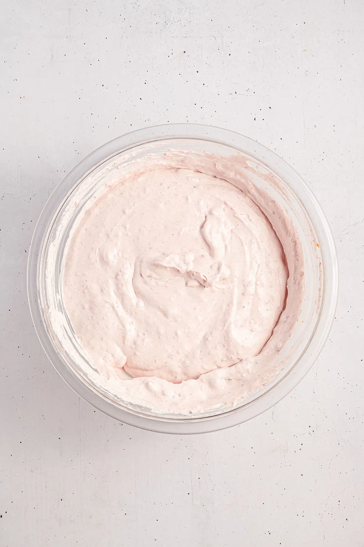 Cranberry cream cheese filling in a glass mixing bowl.
