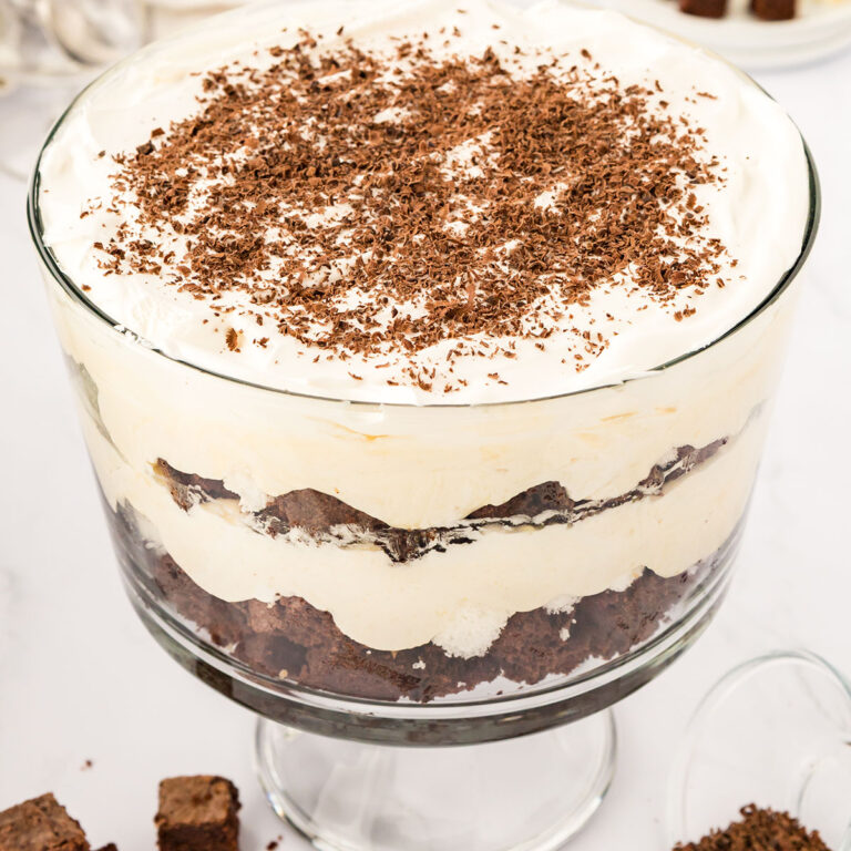 Chocolate Trifle, with layers of brownies, angel food cake, and white chocolate pudding, is served in a glass trifle bowl.
