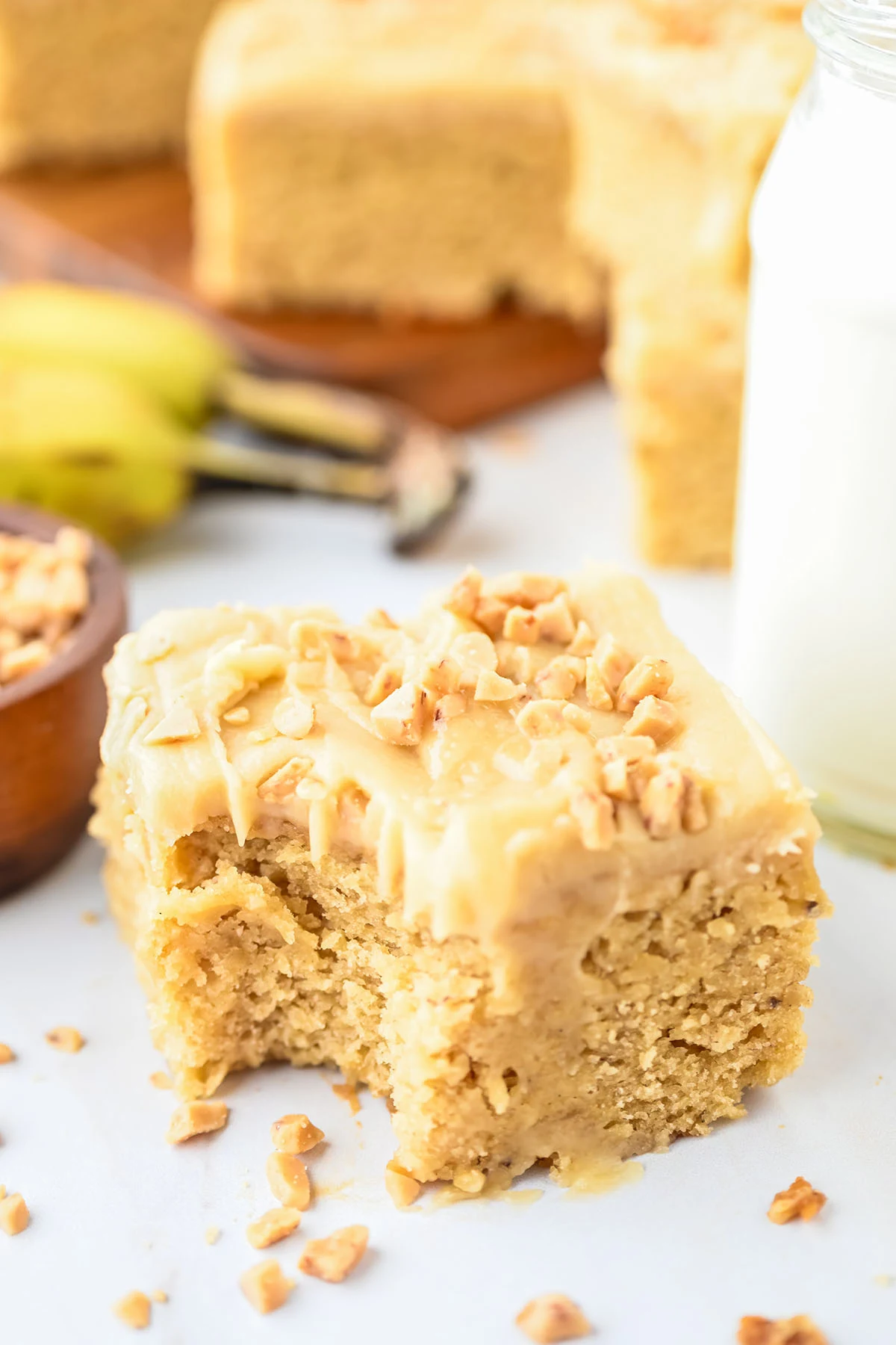 A slice of Banana Blondie with a bite missing.