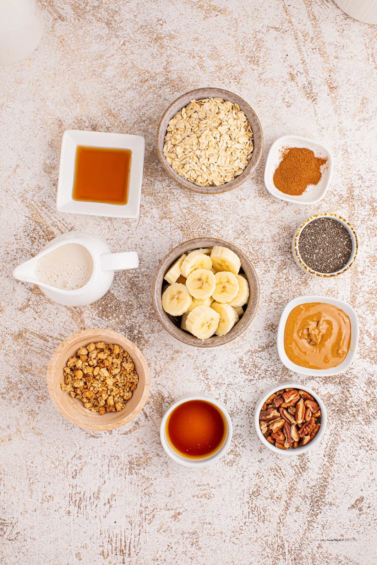 Ingredients to make banana breakfast smoothie set out on the counter.