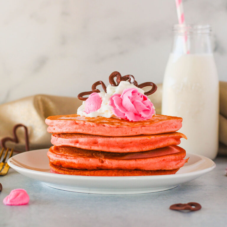 Pink Pancakes on a white plate.