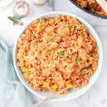 Spanish Rice served in a large white bowl.