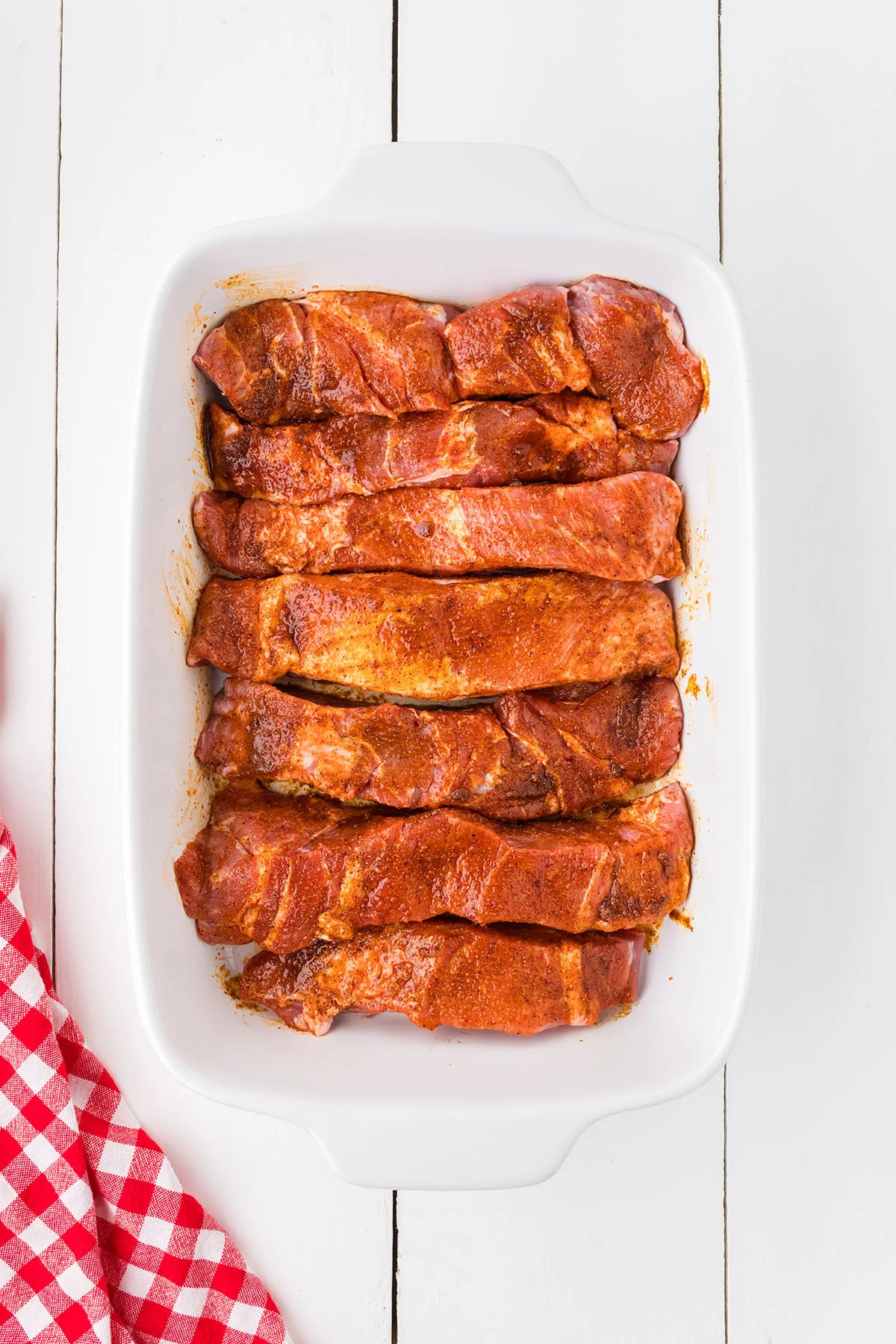 Boneless Pork Ribs coated in the seasoning mix in a baking dish.