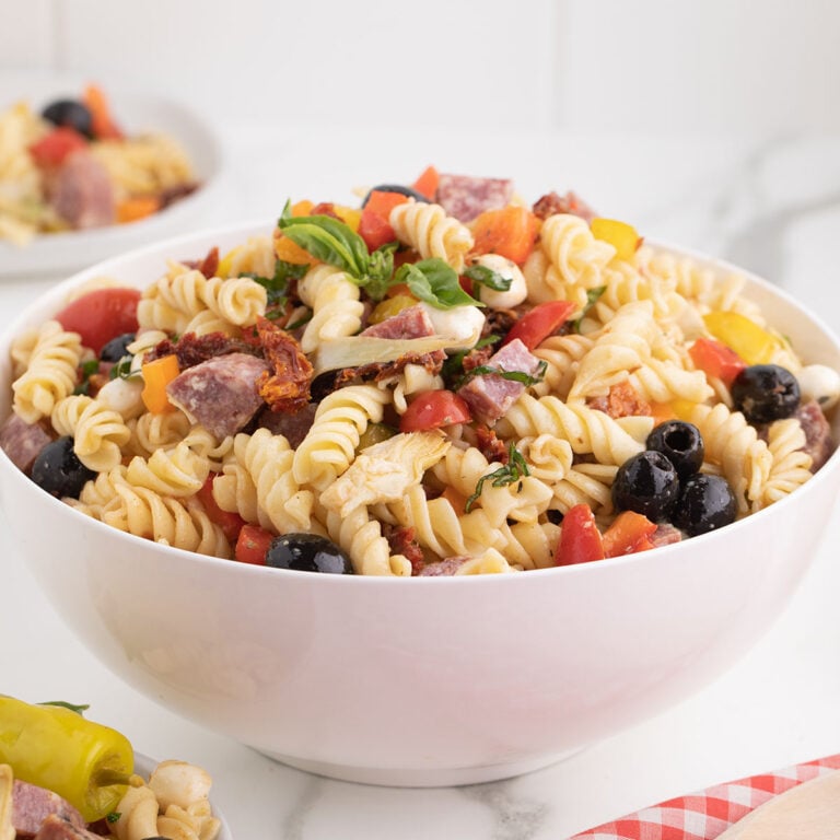 Italian pasta salad in a white serving bowl.