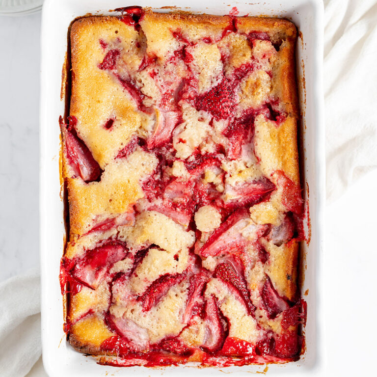 Strawberry Cobbler in a white baking dish.