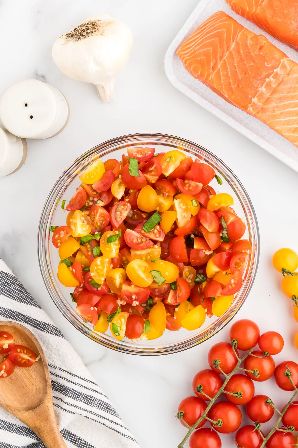 Bruschetta topping mixed together in a glass bowl.